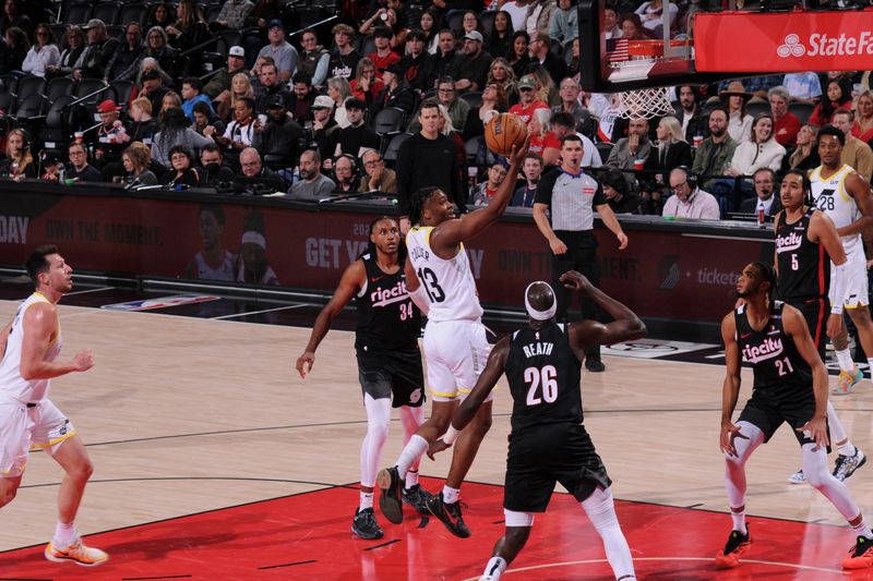 PORTLAND, OR - DECEMBER 6: Isaiah Collier #13 of the Utah Jazz drives to the basket during the game against the Portland Trail Blazers on December 6, 2024 at the Moda Center Arena in Portland, Oregon. NOTE TO USER: User expressly acknowledges and agrees that, by downloading and or using this photograph, user is consenting to the terms and conditions of the Getty Images License Agreement. Mandatory Copyright Notice: Copyright 2024 NBAE (Photo by Cameron Browne/NBAE via Getty Images)