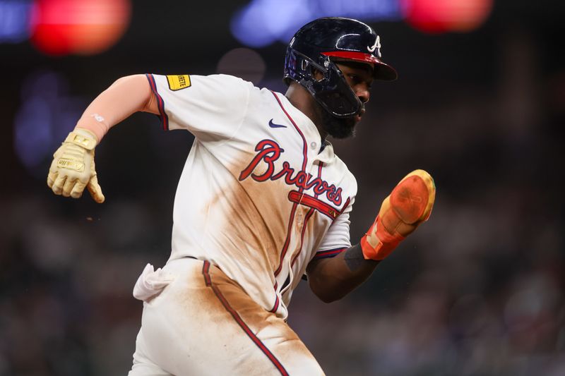 Sep 22, 2025; Atlanta, Georgia, USA; Atlanta Braves center fielder Michael Harris II (23) scores a run against the Washington Nationals in the sixth inning at Truist Park. Mandatory Credit: Brett Davis-Imagn Images
