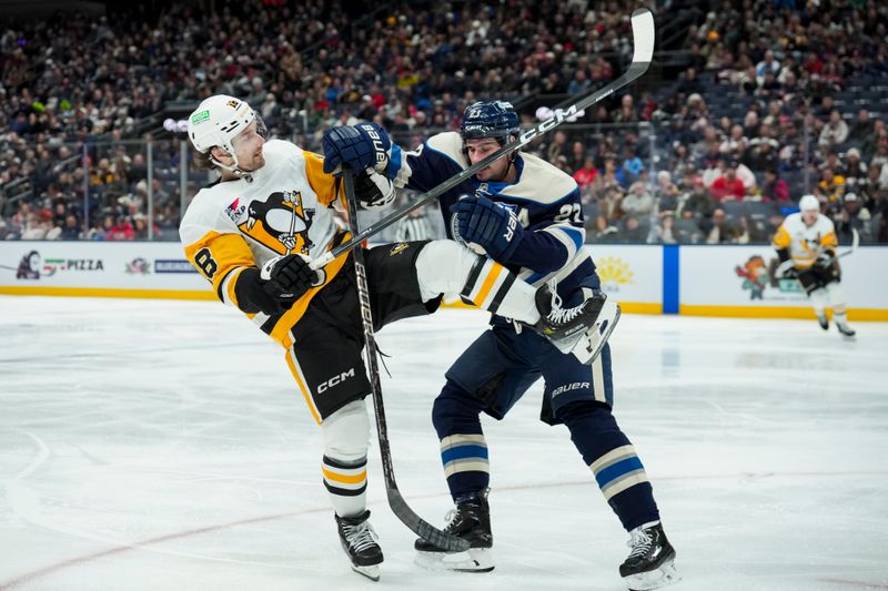 Nov 28, 2025; Columbus, Ohio, USA;  Pittsburgh Penguins center Tommy Novak (18) collides with Columbus Blue Jackets center Sean Monahan (23) in the third period at Nationwide Arena. Mandatory Credit: Aaron Doster-Imagn Images