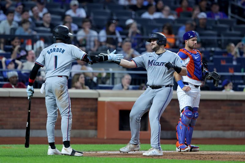 Jun 13, 2024; New York City, New York, USA; Miami Marlins third baseman Jake Burger (36) celebrates his solo home run against the New York Mets with left fielder Nick Gordon (1) during the sixth inning at Citi Field. Mandatory Credit: Brad Penner-USA TODAY Sports