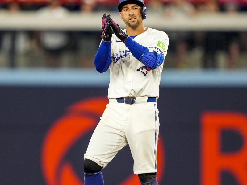 Jun 29, 2024; Toronto, Ontario, CAN; Toronto Blue Jays outfielder George Springer (4) celebrates hitting a double against the New York Yankees during the sixth inning at Rogers Centre. Mandatory Credit: Kevin Sousa-USA TODAY Sports