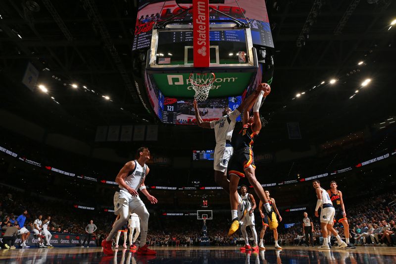 OKLAHOMA CITY, OK - APRIL 14: Olivier Maxence-Prosper #18 of the Dallas Mavericks grabs a rebound during the game against the Oklahoma City Thunder  on April 14, 2024 at Paycom Arena in Oklahoma City, Oklahoma. NOTE TO USER: User expressly acknowledges and agrees that, by downloading and or using this photograph, User is consenting to the terms and conditions of the Getty Images License Agreement. Mandatory Copyright Notice: Copyright 2024 NBAE (Photo by Zach Beeker/NBAE via Getty Images)