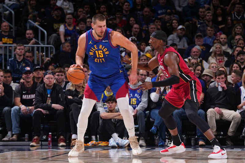 DENVER, CO - NOVEMBER 8: Nikola Jokic #15 of the Denver Nuggets dribbles the ball during the game against the Miami Heat on November 8, 2024 at Ball Arena in Denver, Colorado. NOTE TO USER: User expressly acknowledges and agrees that, by downloading and/or using this Photograph, user is consenting to the terms and conditions of the Getty Images License Agreement. Mandatory Copyright Notice: Copyright 2024 NBAE (Photo by Bart Young/NBAE via Getty Images)