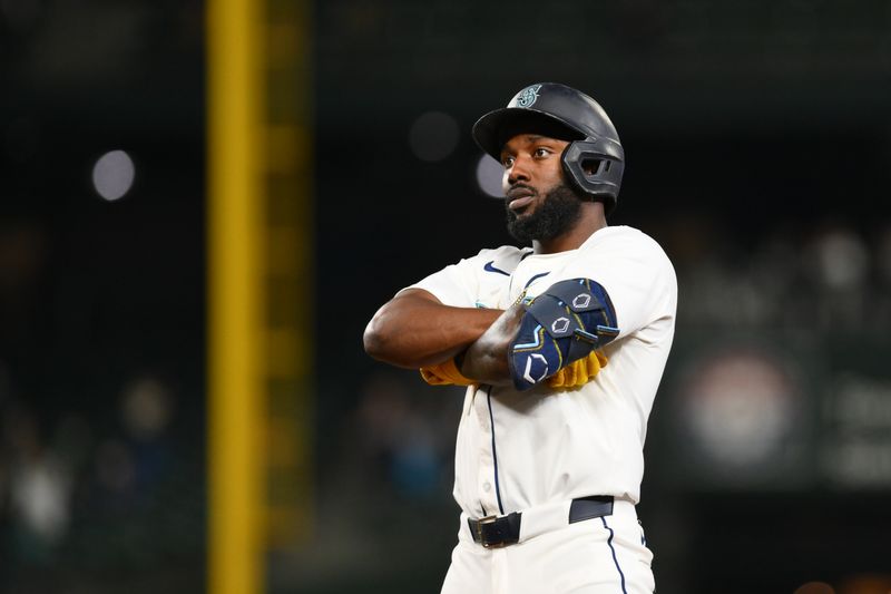 Sep 12, 2024; Seattle, Washington, USA; Seattle Mariners left fielder Randy Arozarena (56) celebrates after hitting a 2-RBI single against the Texas Rangers during the fifth inning at T-Mobile Park. Mandatory Credit: Steven Bisig-Imagn Images