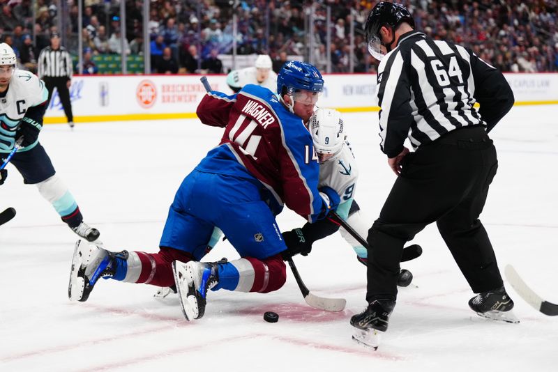 Nov 5, 2024; Denver, Colorado, USA; Seattle Kraken center Chandler Stephenson (9) and Colorado Avalanche right wing Chris Wagner (14) face off in front of NHL linesman Brandon Gawryletz (64) in the first period at Ball Arena. Mandatory Credit: Ron Chenoy-Imagn Images