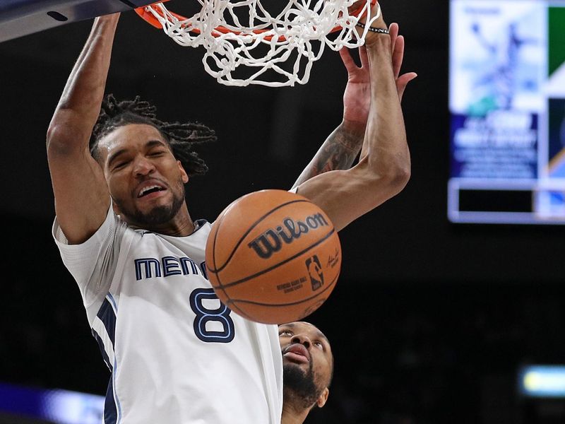 MEMPHIS, TENNESSEE - FEBRUARY 15: Ziaire Williams #8 of the Memphis Grizzlies goes to the basket against Damian Lillard #0 of the Milwaukee Bucks during the second half at FedExForum on February 15, 2024 in Memphis, Tennessee. NOTE TO USER: User expressly acknowledges and agrees that, by downloading and or using this photograph, User is consenting to the terms and conditions of the Getty Images License Agreement. (Photo by Justin Ford/Getty Images)