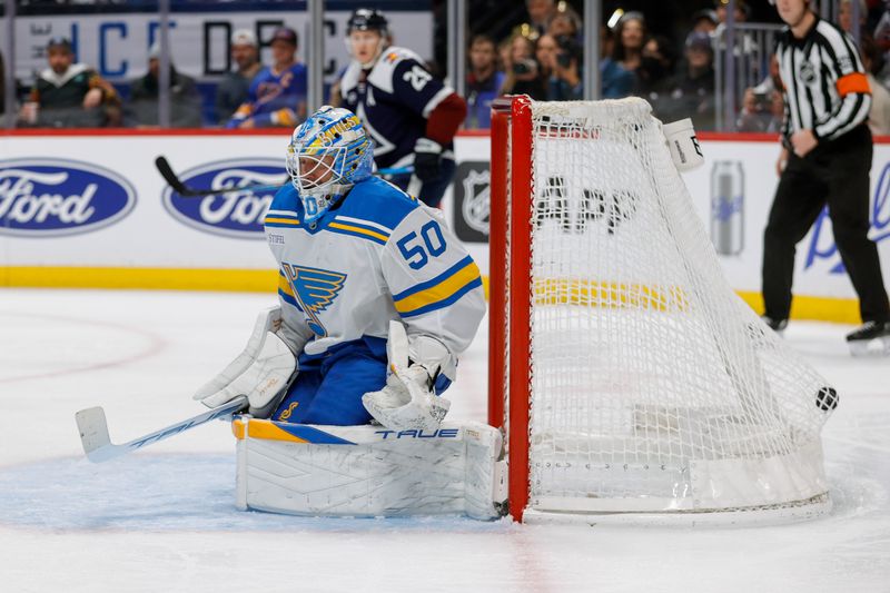 Dec 31, 2025; Denver, Colorado, USA; The puck hits the back of the net on a Colorado Avalanche power play goal against St. Louis Blues goaltender Jordan Binnington (50) in the second period at Ball Arena. Mandatory Credit: Isaiah J. Downing-Imagn Images