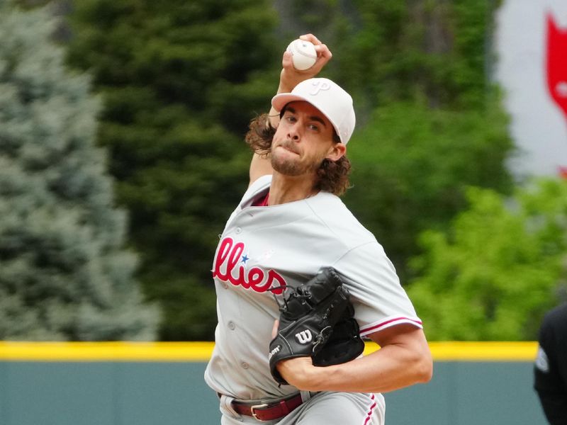 May 14, 2023; Denver, Colorado, USA; Philadelphia Phillies starting pitcher Aaron Nola (27) delivers a pitch in the first inning against the Colorado Rockies at Coors Field. Mandatory Credit: Ron Chenoy-USA TODAY Sports