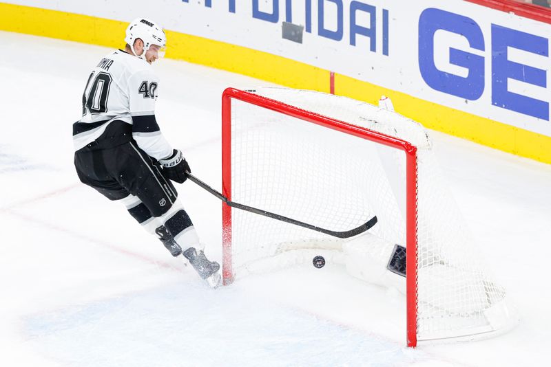 Oct 26, 2025; Chicago, Illinois, USA; Los Angeles Kings right wing Joel Armia (40) scores against the Chicago Blackhawks on the empty-net as he breaks his stick during the third period at United Center. Mandatory Credit: Kamil Krzaczynski-Imagn Images