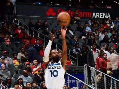 ATLANTA, GA - OCTOBER 30: Mike Conley #10 of the Minnesota Timberwolves shoots a three point basket against the Atlanta Hawks on October 30, 2023 at State Farm Arena in Atlanta, Georgia.  NOTE TO USER: User expressly acknowledges and agrees that, by downloading and/or using this Photograph, user is consenting to the terms and conditions of the Getty Images License Agreement. Mandatory Copyright Notice: Copyright 2023 NBAE (Photo by Scott Cunningham/NBAE via Getty Images)