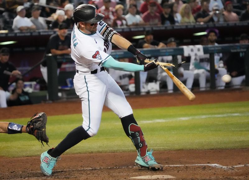 Jun 29, 2023; Phoenix, Arizona, USA; Arizona Diamondbacks third baseman Evan Longoria (3) breaks his bat hitting a single at Chase Field. Mandatory Credit: Joe Rondone-USA TODAY Sports