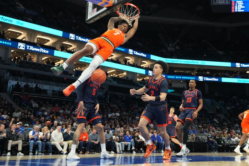 Mar 13, 2026; Charlotte, NC, USA; Miami (FL) Hurricanes forward Shelton Henderson (7) scores as Virginia Cavaliers guard Chance Mallory (2) defends in the first half at Spectrum Center. Mandatory Credit: Bob Donnan-Imagn Images