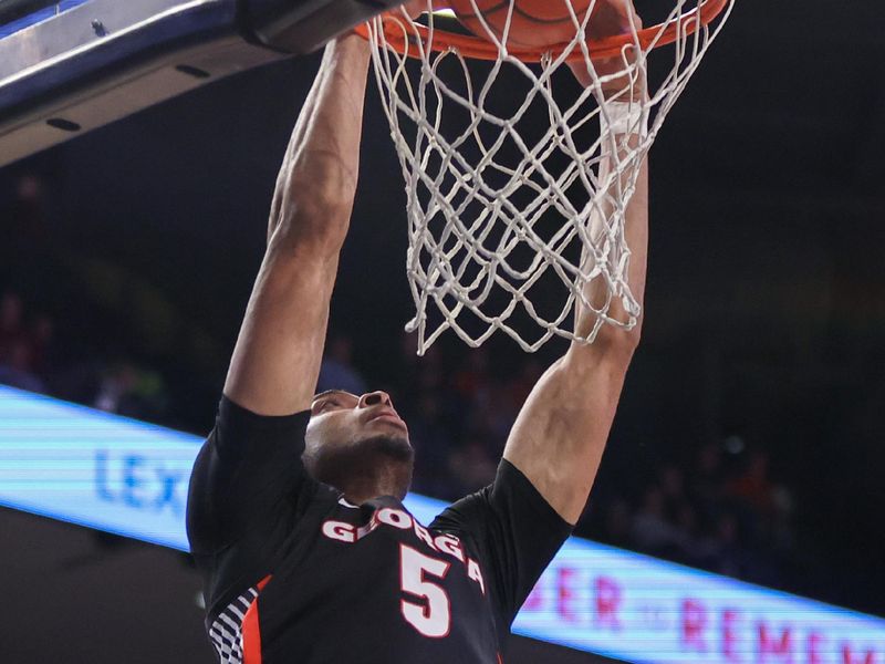 Dec 6, 2022; Atlanta, Georgia, USA; Georgia Bulldogs center Frank Anselem (5) dunks against the Georgia Tech Yellow Jackets in the first half at McCamish Pavilion. Mandatory Credit: Brett Davis-USA TODAY Sports