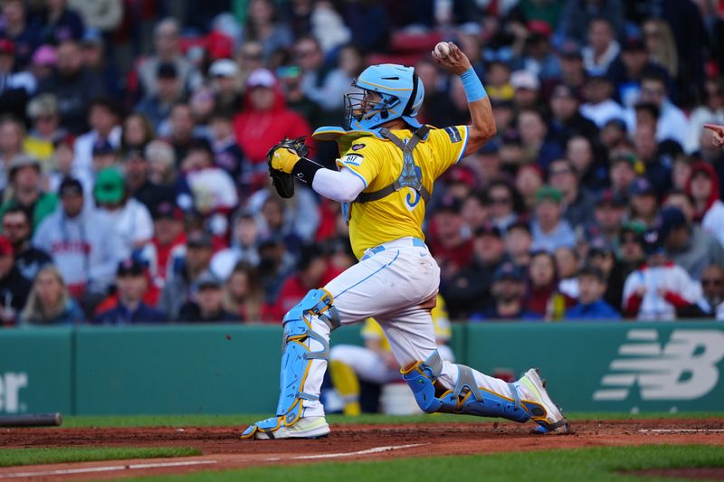 May 11, 2024; Boston, Massachusetts, USA; Boston Red Sox catcher Reese McGuire (3) throws to second base to start a double play after fielding a bunt during the sixth inning against the Washington Nationals at Fenway Park. Mandatory Credit: Gregory Fisher-USA TODAY Sports