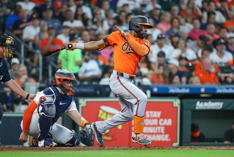 Jun 22, 2024; Houston, Texas, USA; Baltimore Orioles center fielder Cedric Mullins (31) hits an infield single during the fourth inning against the Houston Astros at Minute Maid Park. Mandatory Credit: Troy Taormina-USA TODAY Sports