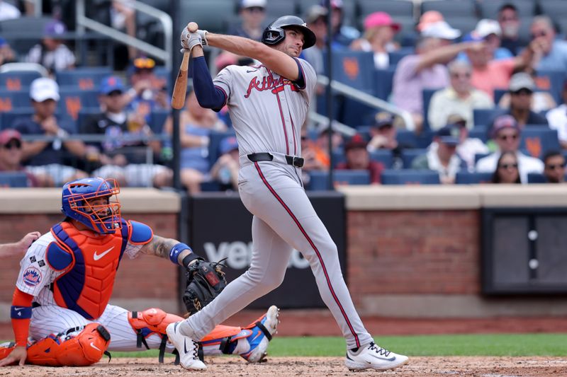 Jul 28, 2024; New York City, New York, USA; Atlanta Braves first baseman Matt Olson (28) follows through on a three run home run against the New York Mets during the fourth inning at Citi Field. Mandatory Credit: Brad Penner-USA TODAY Sports