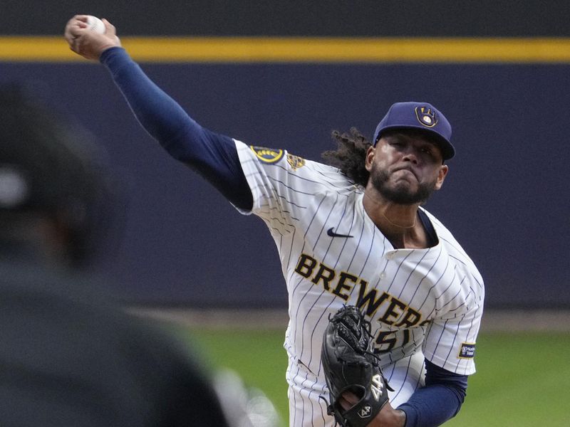 May 4, 2025; Milwaukee, Wisconsin, USA; Milwaukee Brewers pitcher Freddy Peralta (51) delivers a pitch against the Chicago Cubs in the first inning at American Family Field. Mandatory Credit: Michael McLoone-Imagn Images