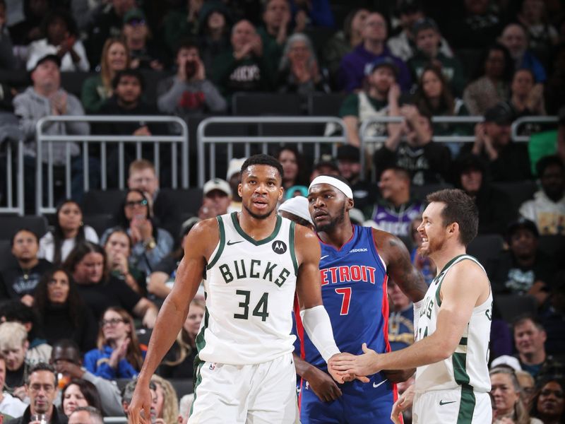 MILWAUKEE, WI - NOVEMBER 13: Giannis Antetokounmpo #34 and Pat Connaughton #24 of the Milwaukee Bucks high five during the game against the Detroit Pistons on November 13, 2024 at the Fiserv Forum Center in Milwaukee, Wisconsin. NOTE TO USER: User expressly acknowledges and agrees that, by downloading and or using this Photograph, user is consenting to the terms and conditions of the Getty Images License Agreement. Mandatory Copyright Notice: Copyright 2024 NBAE (Photo by Gary Dineen/NBAE via Getty Images).