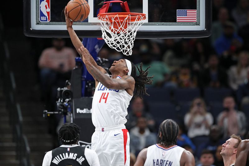 MEMPHIS, TENNESSEE - FEBRUARY 23: Terance Mann #14 of the LA Clippers goes to the basket during the second half against the Memphis Grizzlies at FedExForum on February 23, 2024 in Memphis, Tennessee. NOTE TO USER: User expressly acknowledges and agrees that, by downloading and or using this photograph, User is consenting to the terms and conditions of the Getty Images License Agreement. (Photo by Justin Ford/Getty Images)