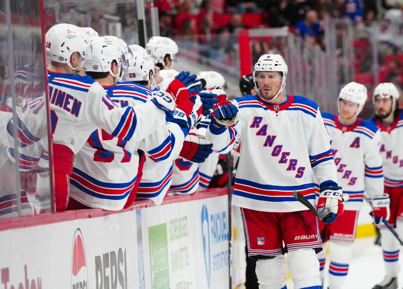 Apr 12, 2025; Raleigh, North Carolina, USA;  New York Rangers left wing J.T. Miller (8) celebrates his goal against the Carolina Hurricanes during the third period at Lenovo Center. Mandatory Credit: James Guillory-Imagn Images