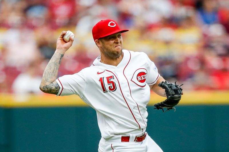 May 7, 2023; Cincinnati, Ohio, USA; Cincinnati Reds third baseman Nick Senzel (15) throws to first in attempt to get Chicago White Sox shortstop Tim Anderson (not pictured) out in the fifth inning at Great American Ball Park. Mandatory Credit: Katie Stratman-USA TODAY Sports