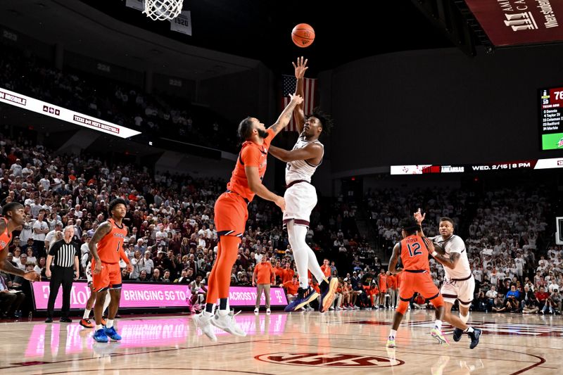 Feb 7, 2023; College Station, Texas, USA; Texas A&M Aggies forward Julius Marble (34) shoots over Auburn Tigers forward Johni Broome (4) during the second half at Reed Arena. Mandatory Credit: Maria Lysaker-USA TODAY Sports