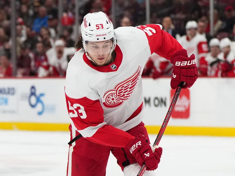 Jan 17, 2024; Sunrise, Florida, USA; Detroit Red Wings defenseman Moritz Seider (53) shoots the puck against the Florida Panthers during the first period at Amerant Bank Arena. Mandatory Credit: Jasen Vinlove-USA TODAY Sports