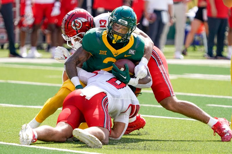 Sep 9, 2023; Waco, Texas, USA; Baylor Bears running back Dominic Richardson (21) is tackled by Utah Utes safety Cole Bishop (8) during the first half at McLane Stadium. Mandatory Credit: Raymond Carlin III-USA TODAY Sports