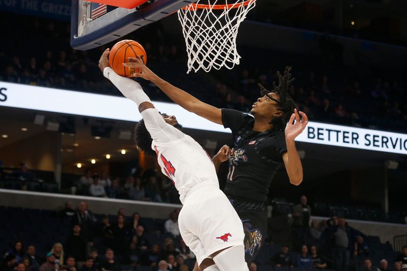 Jan 26, 2023; Memphis, Tennessee, USA; Memphis Tigers guard Johnathan Lawson (11) blocks a dunk attempt by Southern Methodist Mustangs guard Emory Lanier (24) during the second half at FedExForum. Mandatory Credit: Petre Thomas-USA TODAY Sports