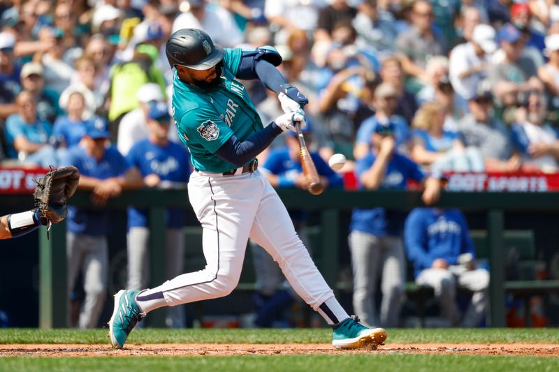 Aug 28, 2023; Seattle, Washington, USA; Seattle Mariners right fielder Teoscar Hernandez (35) hits grand slam home run against the Kansas City Royals during the third inning at T-Mobile Park. Mandatory Credit: Joe Nicholson-USA TODAY Sports