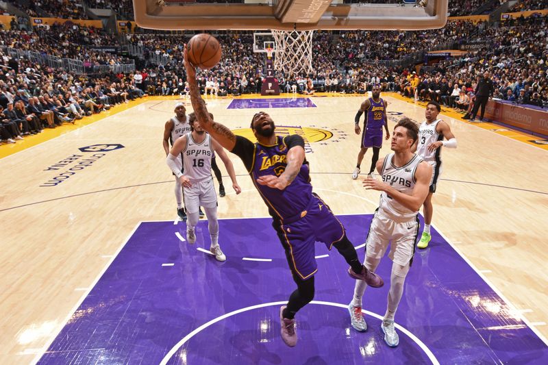 LOS ANGELES, CA - FEBRUARY 23: Anthony Davis #3 of the Los Angeles Lakers drives to the basket during the game against the San Antonio Spurs on Feburary 23, 2024 at Crypto.Com Arena in Los Angeles, California. NOTE TO USER: User expressly acknowledges and agrees that, by downloading and/or using this Photograph, user is consenting to the terms and conditions of the Getty Images License Agreement. Mandatory Copyright Notice: Copyright 2024 NBAE (Photo by Andrew D. Bernstein/NBAE via Getty Images)