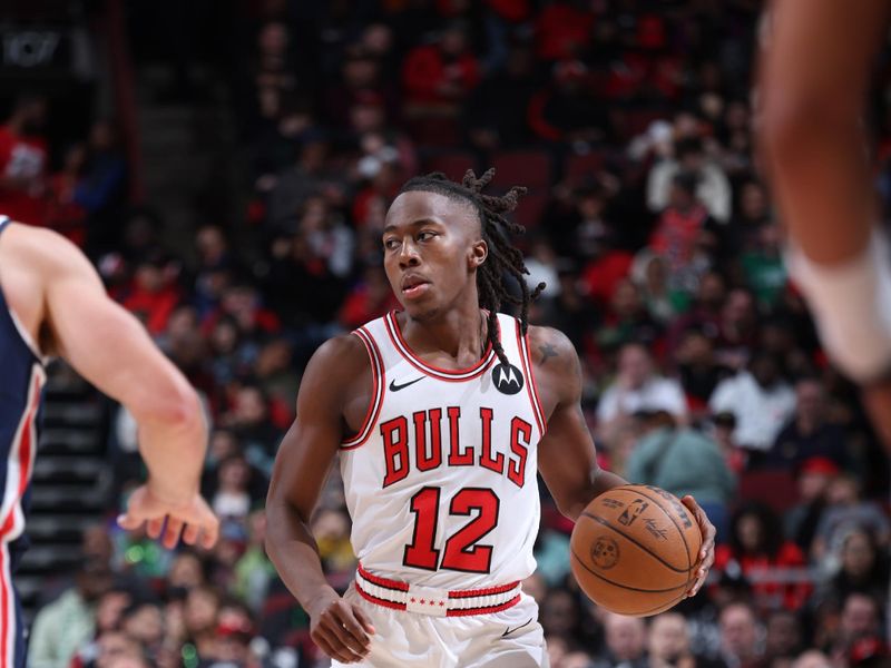 CHICAGO, IL - MARCH 16: Ayo Dosunmu #12 of the Chicago Bulls dribbles the ball during the game against the Washington Wizards on March 16, 2024 at United Center in Chicago, Illinois. NOTE TO USER: User expressly acknowledges and agrees that, by downloading and or using this photograph, User is consenting to the terms and conditions of the Getty Images License Agreement. Mandatory Copyright Notice: Copyright 2024 NBAE (Photo by Jeff Haynes/NBAE via Getty Images)