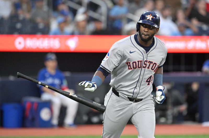Jul 2, 2024; Toronto, Ontario, CAN;  Houston Astros left fielder Yordan Alvarez (44) releases his bat after hitting a three run home run against the Toronto Blue Jays in the fifth inning at Rogers Centre. Mandatory Credit: Dan Hamilton-USA TODAY Sports