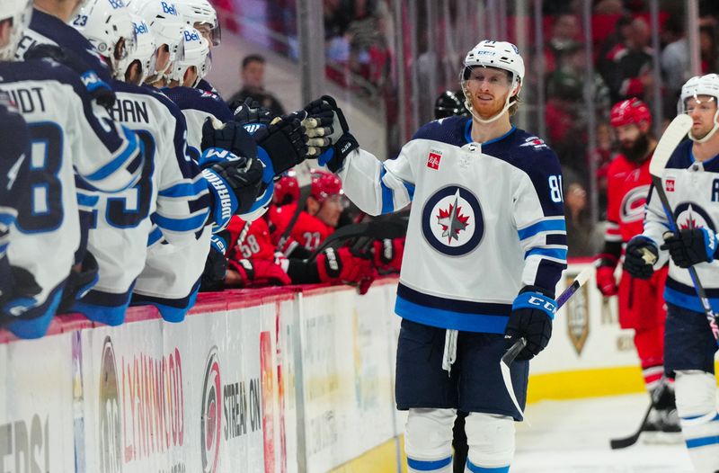 Mar 2, 2024; Raleigh, North Carolina, USA; Winnipeg Jets left wing Kyle Connor (81) celebrates his goal against the Carolina Hurricanes during the third period at PNC Arena. Mandatory Credit: James Guillory-USA TODAY Sports