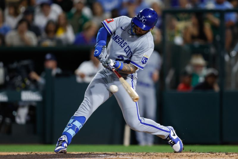 Sep 26, 2025; West Sacramento, California, USA; Kansas City Royals catcher Carter Jensen (22) hits a single during the fourth inning against the Athletics at Sutter Health Park. Mandatory Credit: Sergio Estrada-Imagn Images