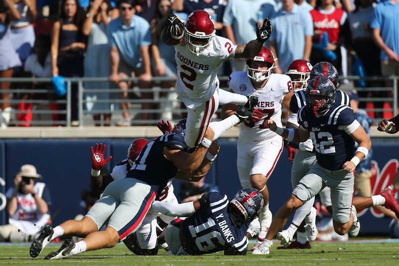 Oct 26, 2024; Oxford, Mississippi, USA; Oklahoma Sooners defensive back Billy Bowman Jr. (2) is flipped in the air as he returns a kickoff during the first half against the Mississippi Rebels at Vaught-Hemingway Stadium. Mandatory Credit: Petre Thomas-Imagn Images
