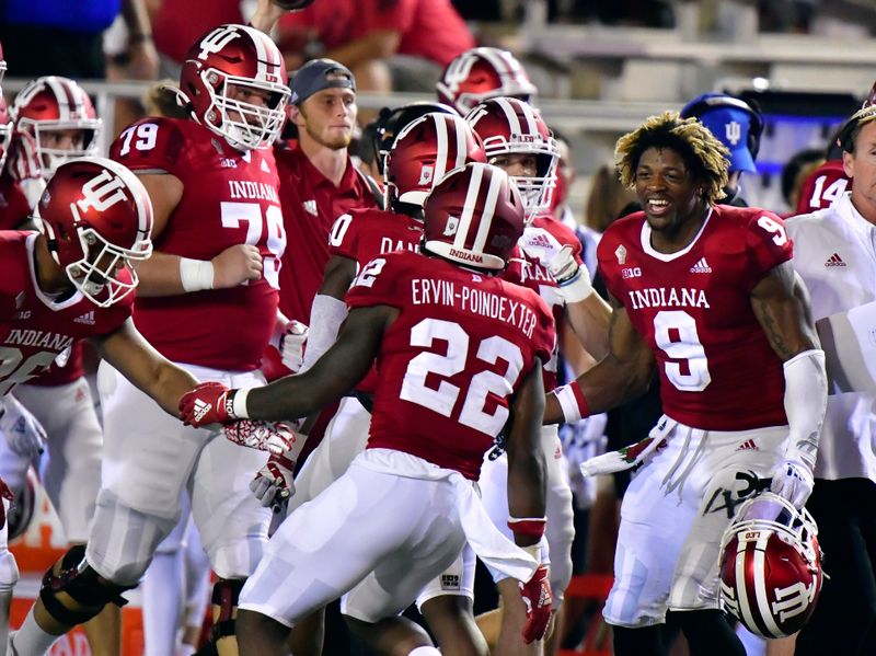 Sep 11, 2021; Bloomington, Indiana, USA; Indiana Hoosiers quarterback Michael Penix Jr. (9) celebrates with teammates after a fumble recovery against the Idaho Vandals during the second half at Memorial Stadium. Indiana won 56-14.  Mandatory Credit: Marc Lebryk-USA TODAY Sports