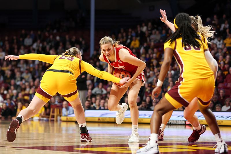 Jan 14, 2024; Minneapolis, Minnesota, USA; Nebraska Cornhuskers forward Natalie Potts (22) works towards the basket as Minnesota Golden Gophers guard Grace Grocholski (25) defends during the second half at Williams Arena. Mandatory Credit: Matt Krohn-USA TODAY Sports