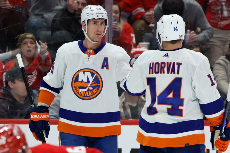 Feb 29, 2024; Detroit, Michigan, USA;  New York Islanders center Brock Nelson (29) receives congratulations from center Bo Horvat (14) after scoring in the third period against the Detroit Red Wings at Little Caesars Arena. Mandatory Credit: Rick Osentoski-USA TODAY Sports