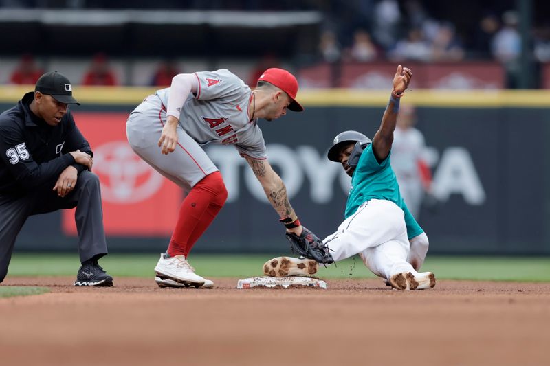 Jun 1, 2024; Seattle, Washington, USA;  Seattle Mariners second baseman Ryan Bliss (1) steals second ahead of the tag from Los Angeles Angels shortstop Zach Neto (9) during the third inning at T-Mobile Park. Mandatory Credit: John Froschauer-USA TODAY Sports