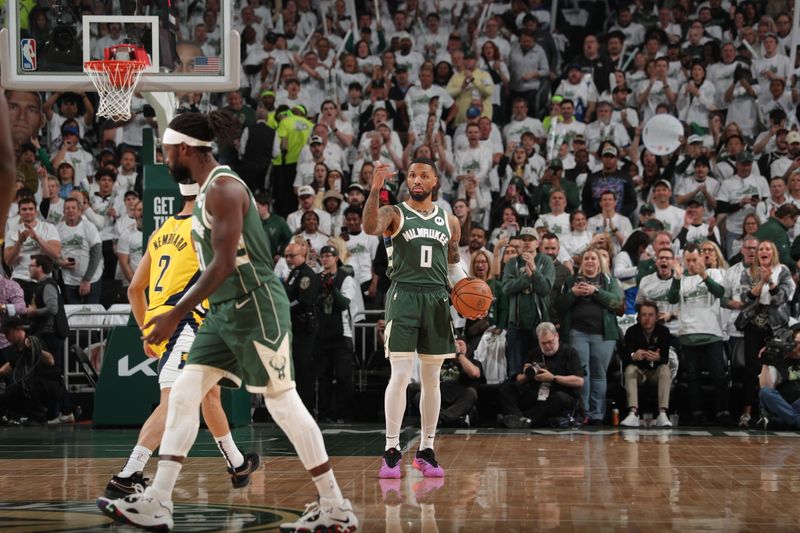 MILWAUKEE, WI - APRIL 23: Damian Lillard #0 of the Milwaukee Bucks dribbles the ball during the game against the Indiana Pacers during Round One Game Two of the 2024 NBA Playoffs on April 23, 2024 at the Fiserv Forum Center in Milwaukee, Wisconsin. NOTE TO USER: User expressly acknowledges and agrees that, by downloading and or using this Photograph, user is consenting to the terms and conditions of the Getty Images License Agreement. Mandatory Copyright Notice: Copyright 2024 NBAE (Photo by Gary Dineen/NBAE via Getty Images).