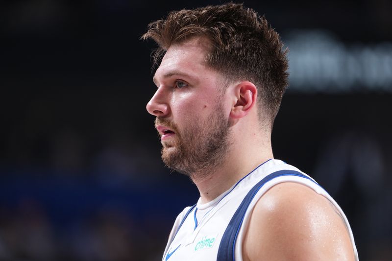 DALLAS, TX - MARCH 13: Luka Doncic #77 of the Dallas Mavericks looks on during the game against the Golden State Warriors on March 13, 2024 at the American Airlines Center in Dallas, Texas. NOTE TO USER: User expressly acknowledges and agrees that, by downloading and or using this photograph, User is consenting to the terms and conditions of the Getty Images License Agreement. Mandatory Copyright Notice: Copyright 2024 NBAE (Photo by Glenn James/NBAE via Getty Images)