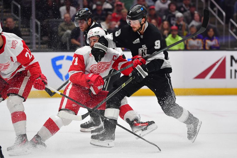 Oct 30, 2025; Los Angeles, California, USA; Detroit Red Wings center Dylan Larkin (71) defends against Los Angeles Kings right wing Adrian Kempe (9) during the second period at Crypto.com Arena. Mandatory Credit: Gary A. Vasquez-Imagn Images