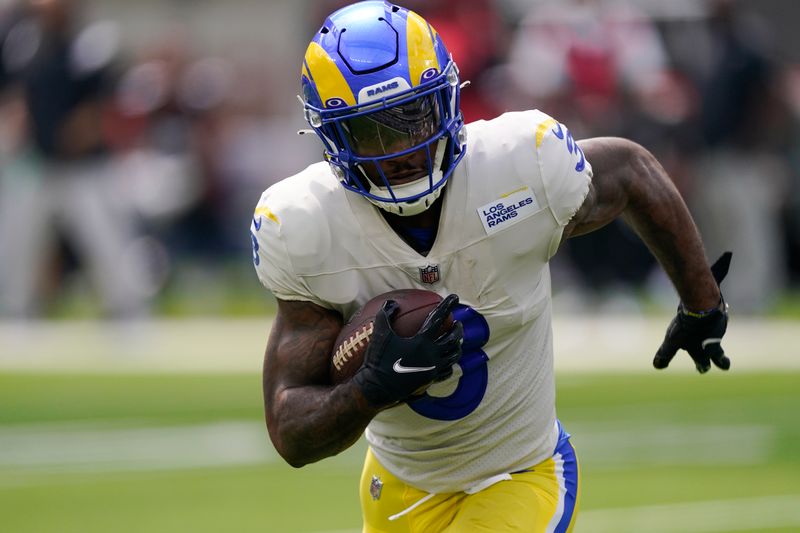 Los Angeles Rams running back Cam Akers runs with the ball during the first half of an NFL football game against the Atlanta Falcons, Sunday, Sept. 18, 2022, in Inglewood, Calif. (AP Photo/Mark J. Terrill)