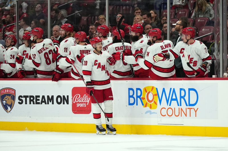 Nov 10, 2023; Sunrise, Florida, USA; Carolina Hurricanes center Sebastian Aho (20) celebrates with teammates after scoring a goal against the Florida Panthers during the second period at Amerant Bank Arena. Mandatory Credit: Jasen Vinlove-USA TODAY Sports