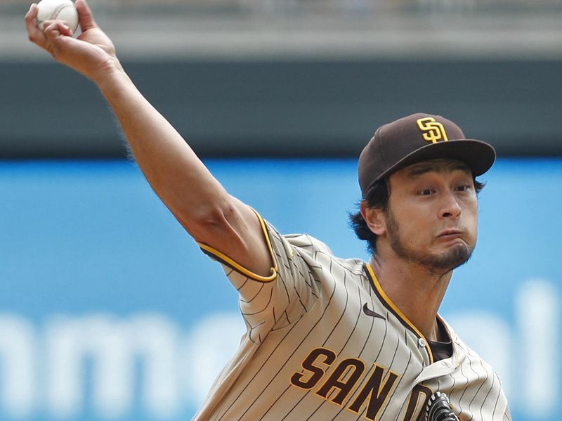 May 11, 2023; Minneapolis, Minnesota, USA; San Diego Padres starting pitcher Yu Darvish (11) throws to the Minnesota Twins in the first inning at Target Field. Mandatory Credit: Bruce Kluckhohn-USA TODAY Sports