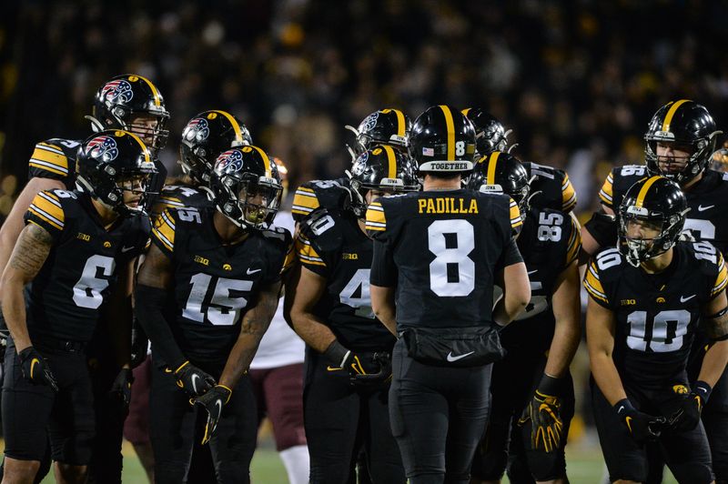 Nov 13, 2021; Iowa City, Iowa, USA; Iowa Hawkeyes quarterback Alex Padilla (8) huddles with the offense against the Minnesota Golden Gophers at Kinnick Stadium. Mandatory Credit: Jeffrey Becker-USA TODAY Sports