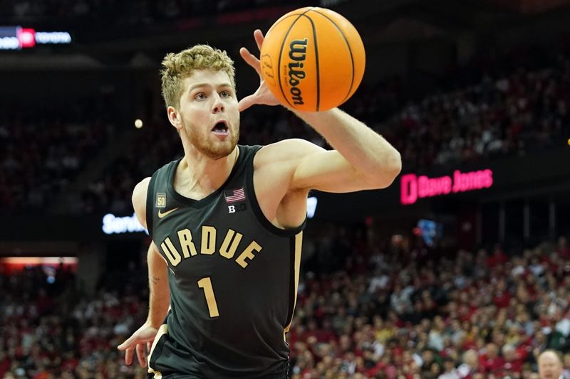 Mar 2, 2023; Madison, Wisconsin, USA;  Purdue Boilermakers forward Caleb Furst (1) attempts to keep the ball inbounds during the first half against the Wisconsin Badgers at the Kohl Center. Mandatory Credit: Kayla Wolf-USA TODAY Sports