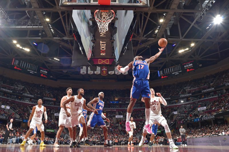 CLEVELAND, OH - MARCH 29: Buddy Heild #17 of the Philadelphia 76ers rebounds during the game against the Cleveland Cavaliers on March 29, 2024 at Rocket Mortgage FieldHouse in Cleveland, Ohio. NOTE TO USER: User expressly acknowledges and agrees that, by downloading and/or using this Photograph, user is consenting to the terms and conditions of the Getty Images License Agreement. Mandatory Copyright Notice: Copyright 2024 NBAE (Photo by David Liam Kyle/NBAE via Getty Images)