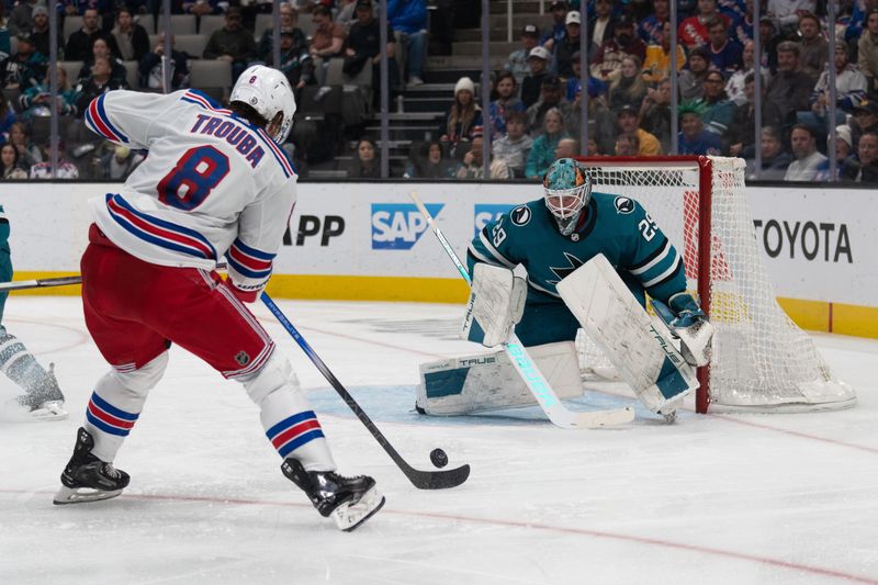 Jan 23, 2024; San Jose, California, USA; San Jose Sharks goaltender Mackenzie Blackwood (29) watches the puck during the third period against New York Rangers defenseman Jacob Trouba (8) at SAP Center at San Jose. Mandatory Credit: Stan Szeto-USA TODAY Sports